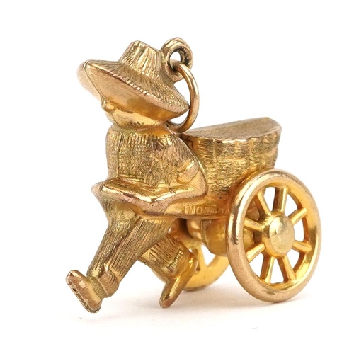 2159 - 9ct gold Chinese street vendor charm with rotating wheels, 1.9cm high, 2.5g