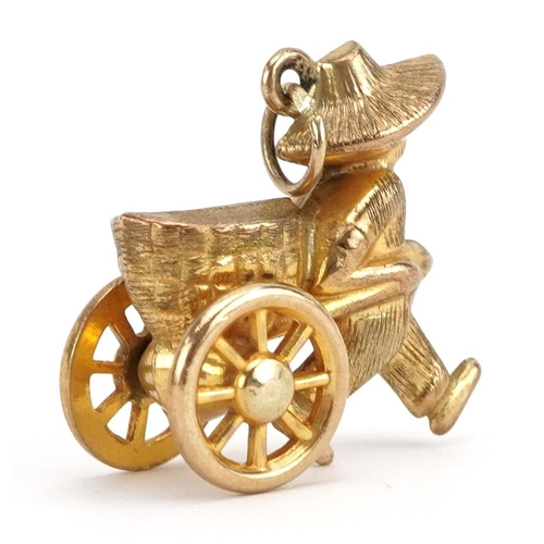 2159 - 9ct gold Chinese street vendor charm with rotating wheels, 1.9cm high, 2.5g