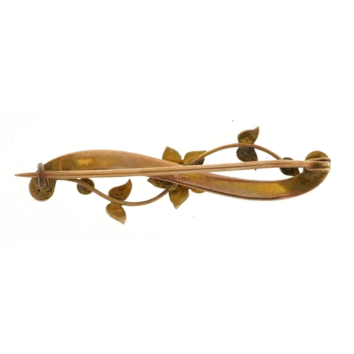 2053 - Edwardian 9ct gold seed pearl floral bar brooch housed in a tooled leather box, 4cm wide, 2.0g