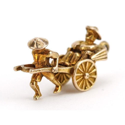 2142 - 9ct gold man pulling a rickshaw charm, 2.1cm wide, 2.5g