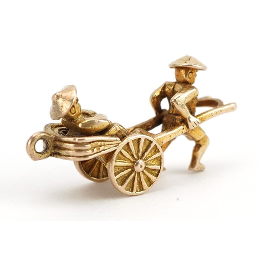 2142 - 9ct gold man pulling a rickshaw charm, 2.1cm wide, 2.5g
