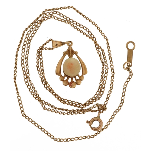 2177 - Gold openwork drop pendant, possibly set with mother of pearl, on a 10k gold necklace, indistinctly ... 
