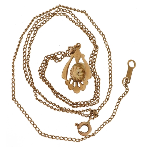 2177 - Gold openwork drop pendant, possibly set with mother of pearl, on a 10k gold necklace, indistinctly ... 