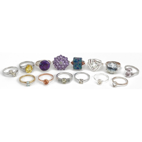2174 - Fourteen silver rings, some set with semi precious stones including amethyst, aquamarine and citrine... 