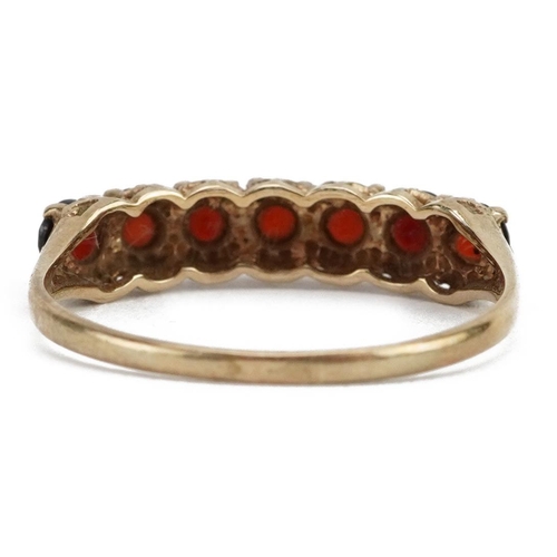 2155 - 9ct gold garnet seven stone ring, size P, 1.6g