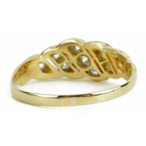 2032 - 18ct gold diamond crossover ring housed in an A Brown leather box, the largest diamond approximately... 