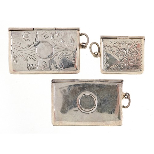 170 - Three silver stamp cases in the form of envelopes, two with engraved decoration, one with London imp... 