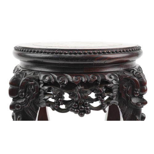 268 - Chinese hardwood vase stand with inset marble top finely carved with mythical faces and foliage, pos... 