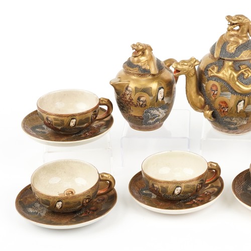 265 - Japanese Satsuma pottery six place tea service hand painted with Geishas and immortals, housed in a ... 