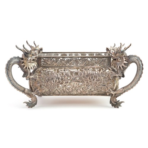 17 - Hung Chong & Co, Good Chinese export silver bowl with glass liner and four dragon handles, profusely... 