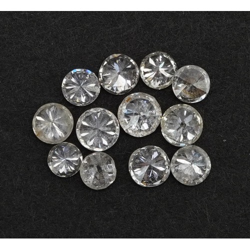 2114 - Twelve loose solitaire diamonds, the largest approximately 3.6mm in diameter, total weight approxima... 