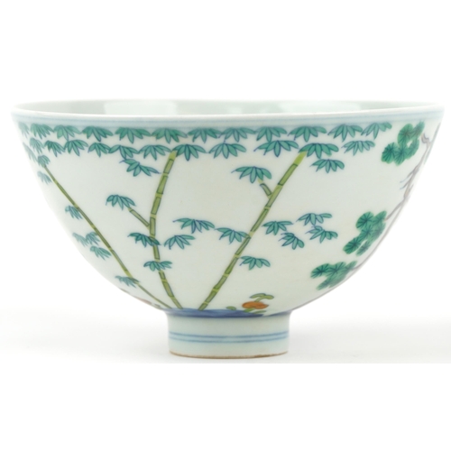 384 - Chinese porcelain wucai footed bowl hand painted trees, six figure character marks to the interior, ... 