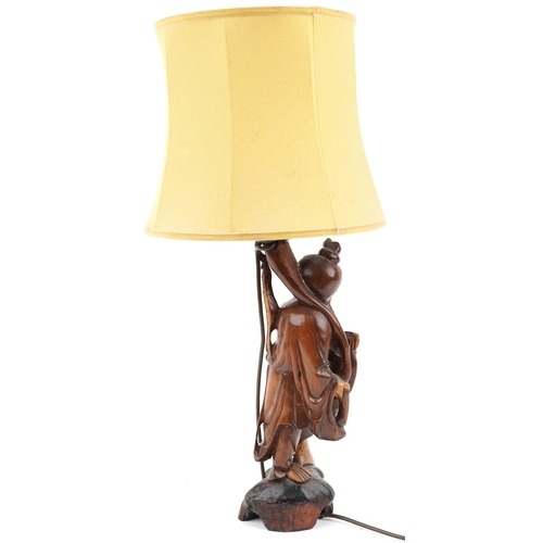 217 - Chinese root wood table lamp with shade carved in the form of a fisherman, overall 68cm high