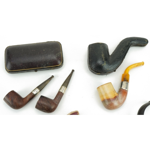 245 - Victorian smoking pipes, four with silver mounts including a pair by G B D housed in a fitted tooled... 