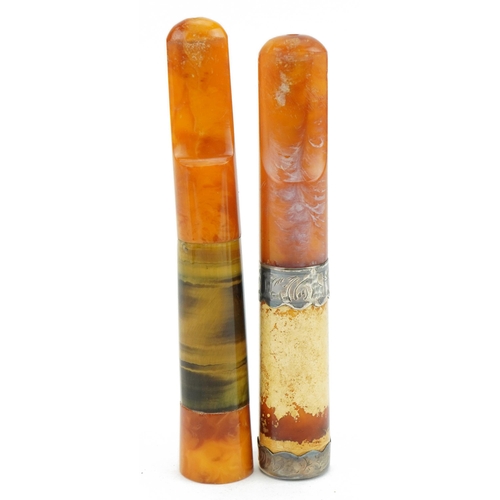 240 - Two large late 19th/early 20th century butterscotch amber cigarette holders comprising one with tige... 