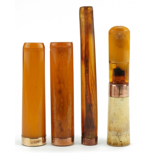 122 - Four late 19th/early 20th century amber and amber coloured cigarette holders with 9ct gold and 18ct ... 