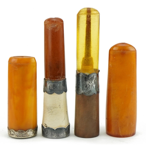 118 - Four late 19th/early 20th century cigarette holders including two butterscotch amber examples, three... 