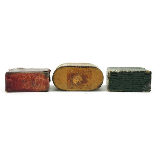 301 - Three early 20th century leather cased metal vestas with leather overlay impressed Vesta and Light, ... 