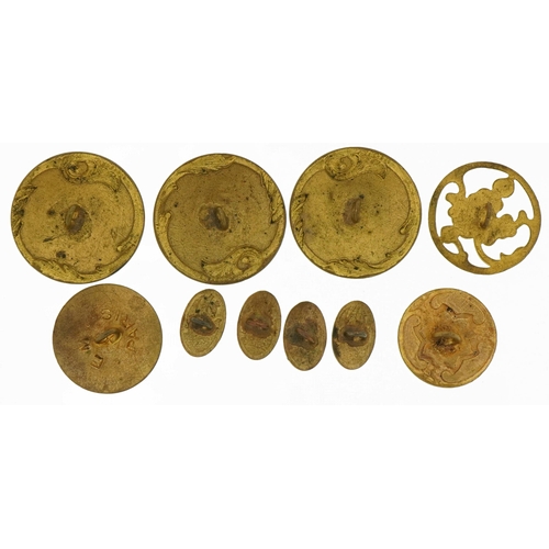 84 - Ten early 20th century brass and enamel buttons comprising nine hand painted with flowers and an Art... 