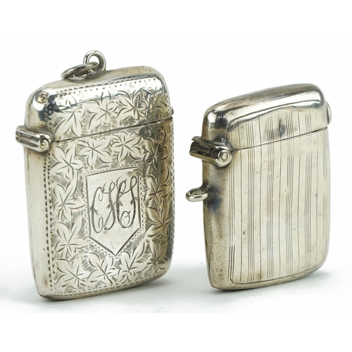 320 - Two rectangular silver vestas including one engraved with foliage, the largest 4.6cm high, total 36.... 