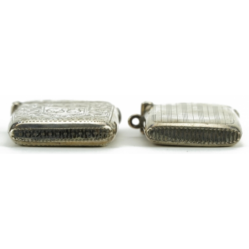 320 - Two rectangular silver vestas including one engraved with foliage, the largest 4.6cm high, total 36.... 