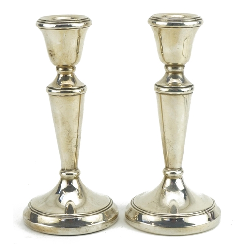 427 - Pair of circular silver tapering candlesticks, D P maker's mark, Birmingham 1987, 14.5cm high, 278.0... 