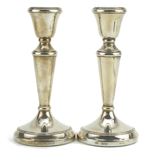 427 - Pair of circular silver tapering candlesticks, D P maker's mark, Birmingham 1987, 14.5cm high, 278.0... 