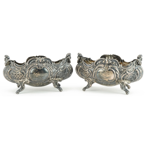 266 - Charles Boyton, pair of Victorian silver open salts mounted with Putti, London 1895, 8.5cm in length... 