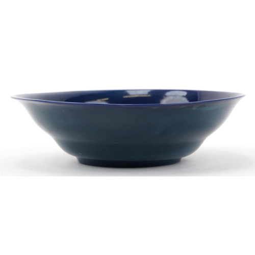 148 - W H Austin for Royal Worcester, Sabrina Ware bowl decorated with tonal blue fish onto a blue ground,... 