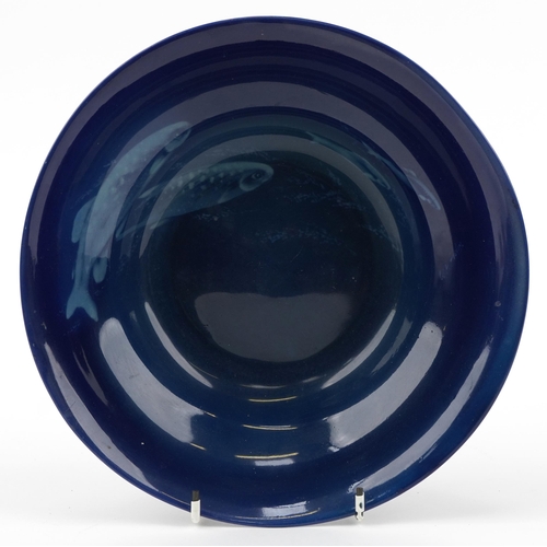 148 - W H Austin for Royal Worcester, Sabrina Ware bowl decorated with tonal blue fish onto a blue ground,... 