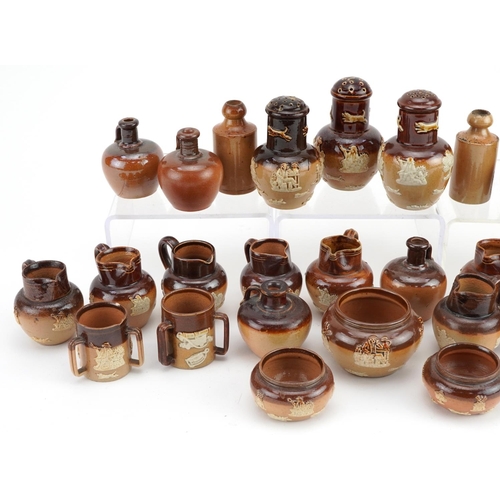 390 - Collection of Doulton Lambeth stoneware miniatures including jugs, flagons and a set of three sifter... 