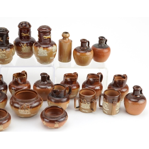 390 - Collection of Doulton Lambeth stoneware miniatures including jugs, flagons and a set of three sifter... 