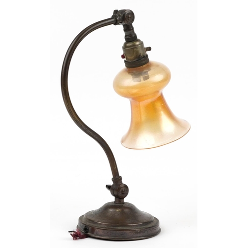 284 - Early 20th century adjustable brass desk lamp with iridescent glass shade, 32.5cm high