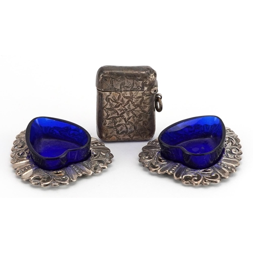 513 - William Henry Leather, pair of silver love heart shaped open salts with blue glass liners and a silv... 