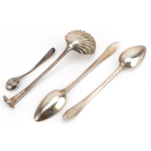 143 - Four Georgian and later silver spoons including a George III sifting spoon, the largest 17.5cm in le... 