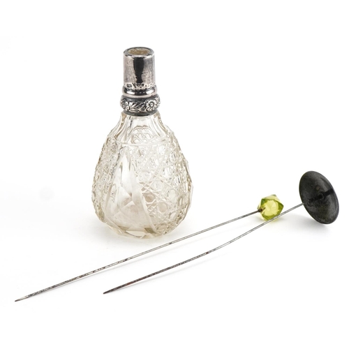 518 - Cut glass scent bottle with silver mount and two hatpins including one with green and white guilloch... 