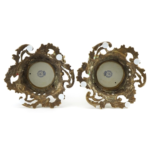 314 - Pair of continental porcelain bird design candlesticks with gilt bronze mounts, each 36cm high