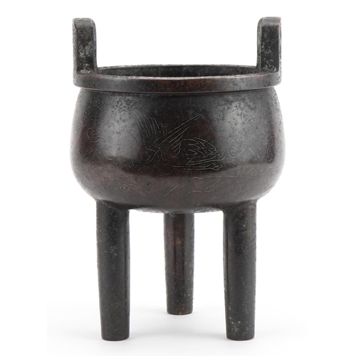46 - Chinese patinated bronze tripod censer with twin handles and white metal inlay depicting animals, ch... 