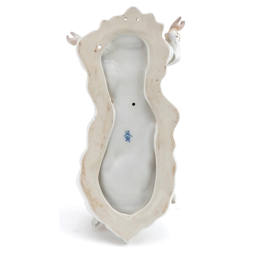 1379 - Continental porcelain holy water font with Christ and Putti, 27cm high