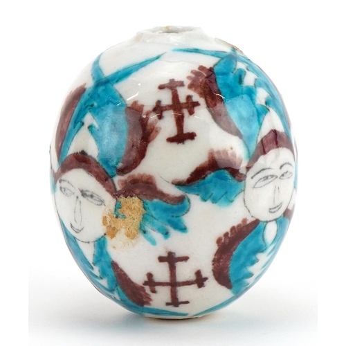 60 - Turkish Ottoman Kutahya Armenian pottery hanging ball hand painted with faces and crosses, 8.5cm hig... 