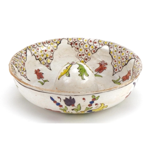 58 - Turkish Kutahya pottery lemon juicer hand painted with stylised flowers, 16cm in diameter