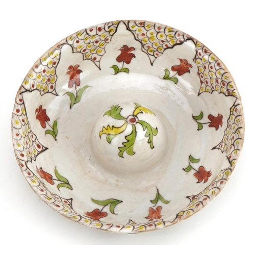 58 - Turkish Kutahya pottery lemon juicer hand painted with stylised flowers, 16cm in diameter