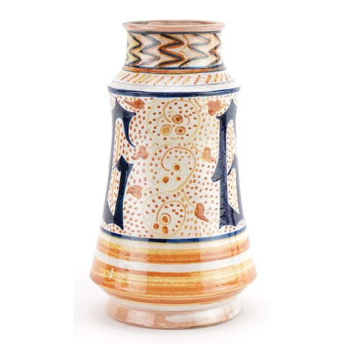 173 - Italian style Albarello pottery drug jar hand painted with stylised motifs, 24.5cm high