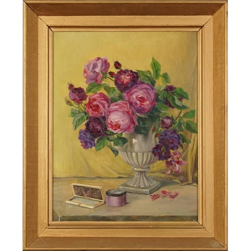 294 - Still life roses in an urn, oil on canvas board, indistinctly signed and dated, possibly 1929, mount... 