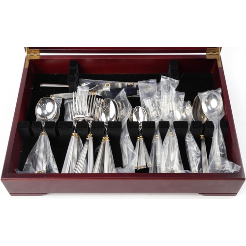 1085 - Guy Degrenne six place mahogany canteen of silver plated cutlery for the Orfevre Collection, the can... 