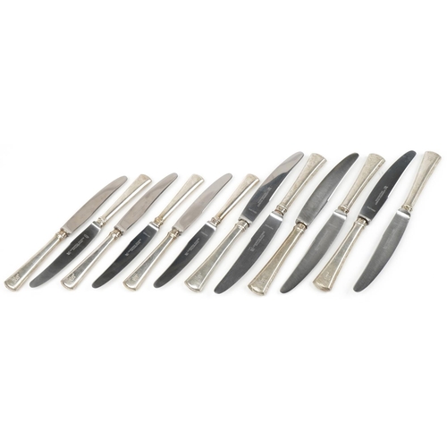 510 - Two sets of six J A Henckels silver handled knives, the largest 25.5cm in length