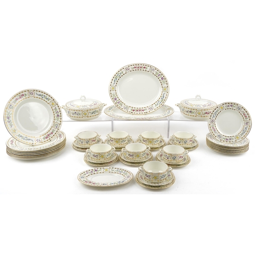 1084 - Royal Worcester Trianon dinnerware including two lidded tureens, oval platters and dinner plates, th... 