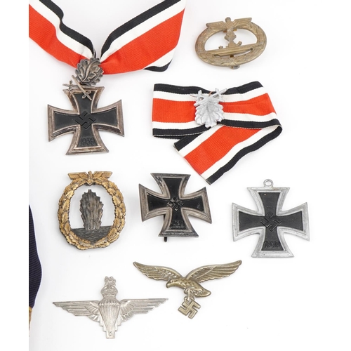 1741 - Militaria including two naval peak caps German badges and a tunic with German cloth badge