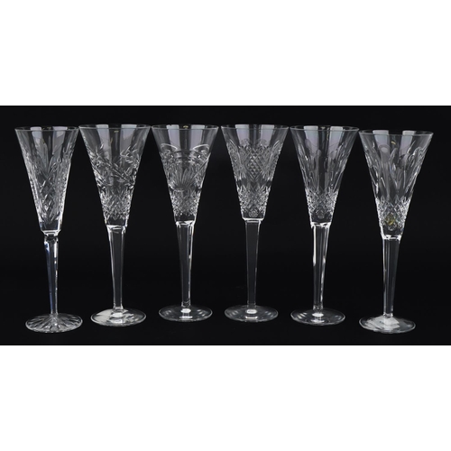 1097 - Six Waterford Crystal toasting flutes housed in celebration boxes, the largest 26cm high