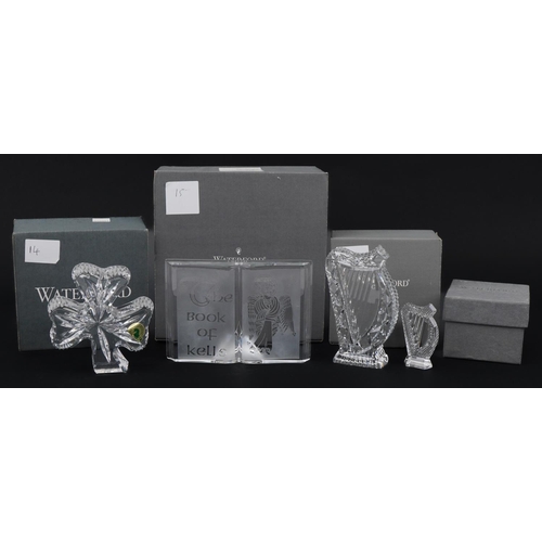 1103 - Waterford Crystal with boxes including five inch shamrock paperweight and Book of Kells, the largest... 